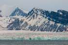 Ice capped mountains and a glacier border Kongsfjorden near Ny-Alesund-Spitsbergen Island-Norway Art Print